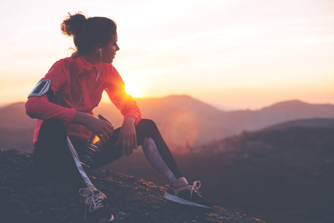 Woman resting at sunset