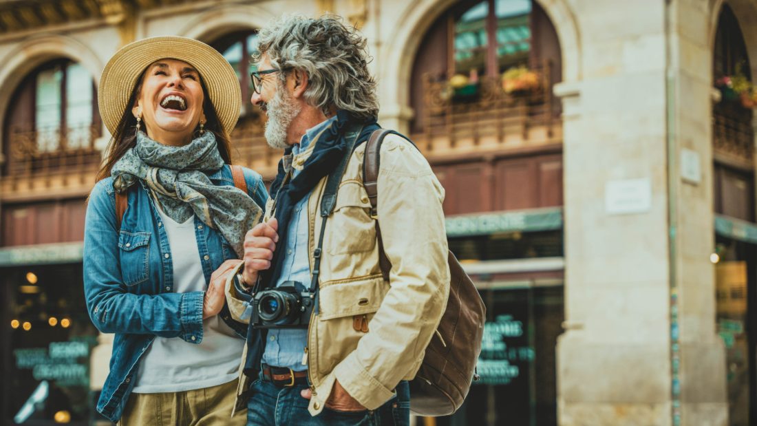 Senior couple traveling and laughing