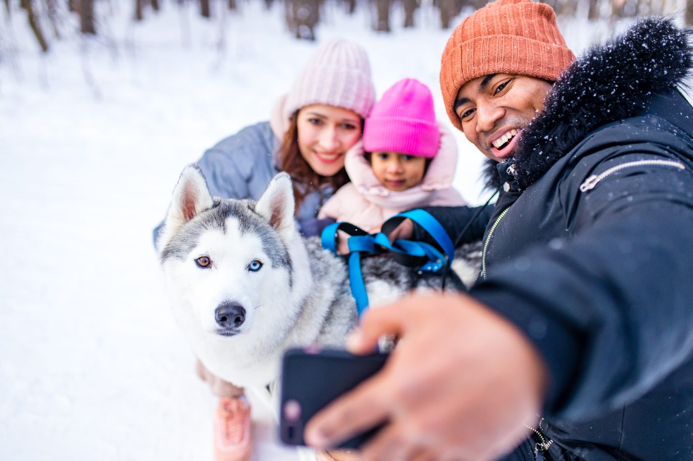 Family building a snowman
